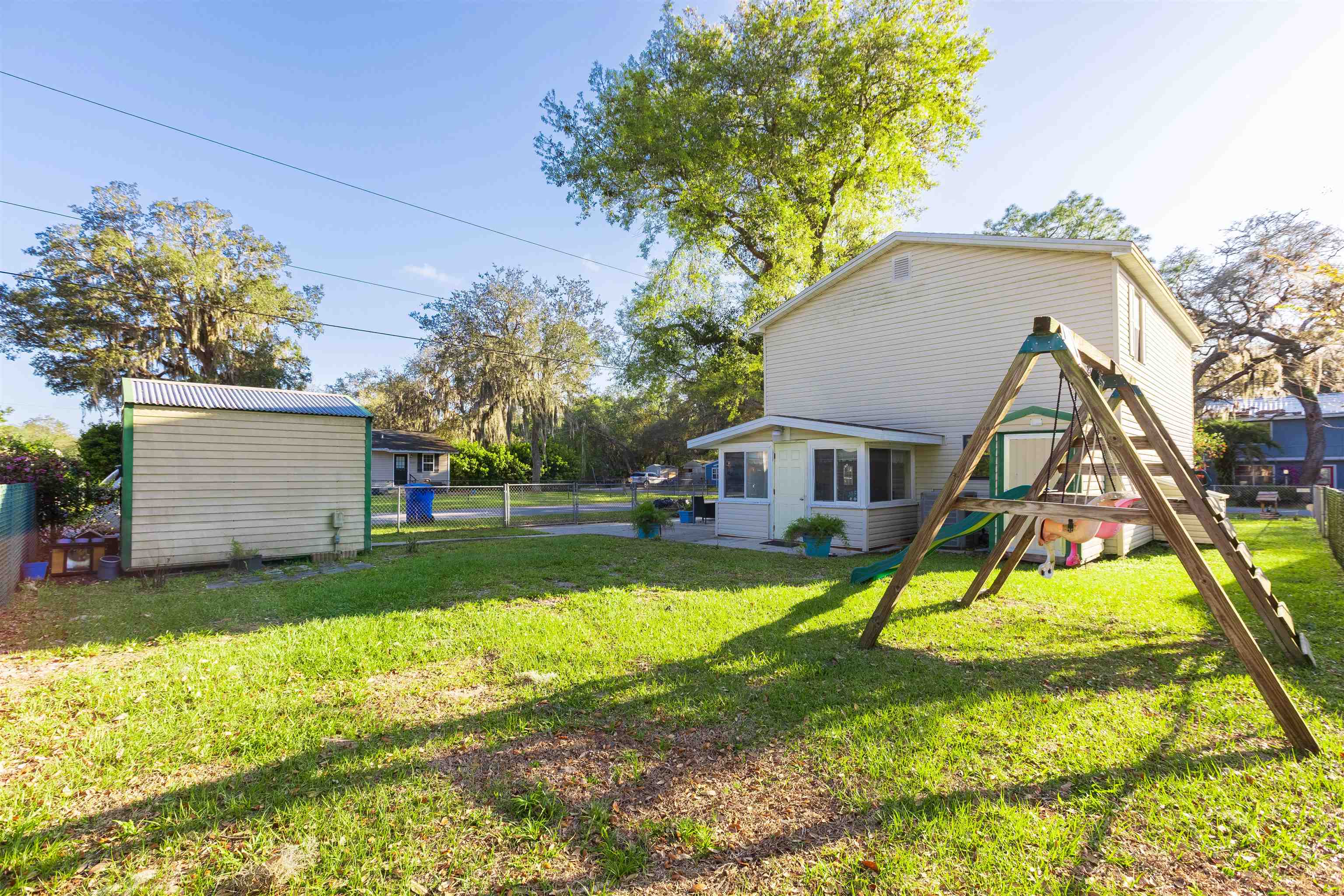 4240 New Hampshire Road Elkton, FL 32033 - Photo 13 of 35 a view of a house with a yard and a tree