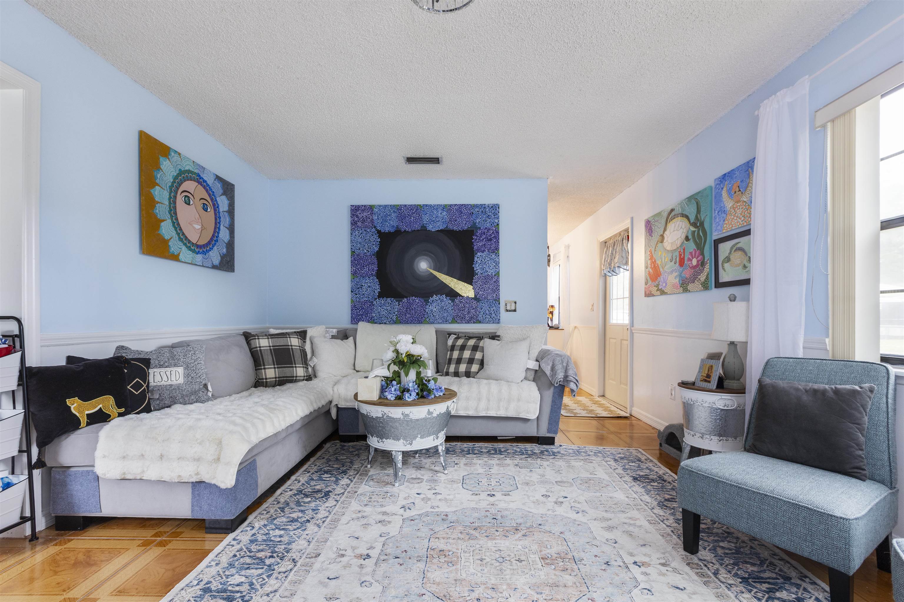 4240 New Hampshire Road Elkton, FL 32033 - Photo 15 of 35 a living room with furniture and a rug