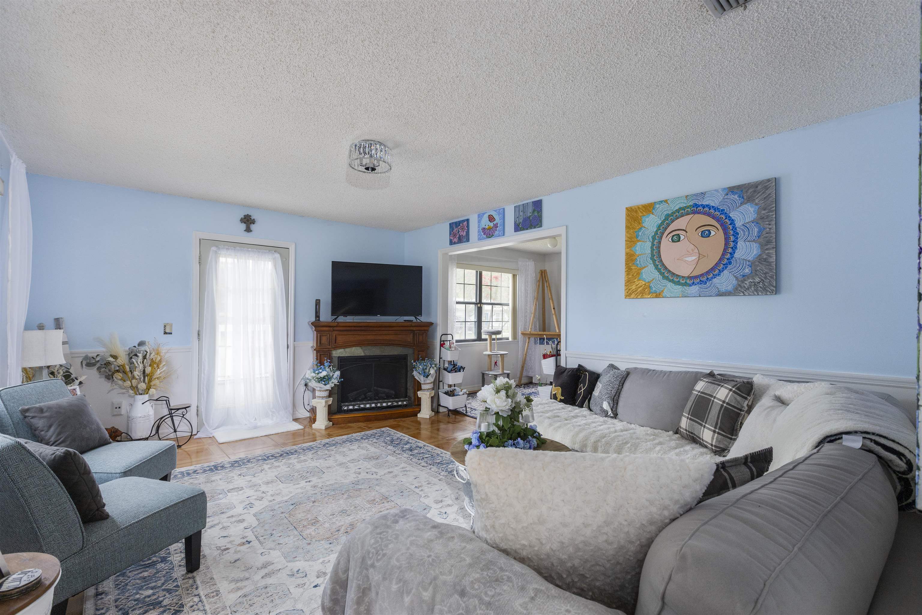 4240 New Hampshire Road Elkton, FL 32033 - Photo 16 of 35 a living room with furniture and a fireplace