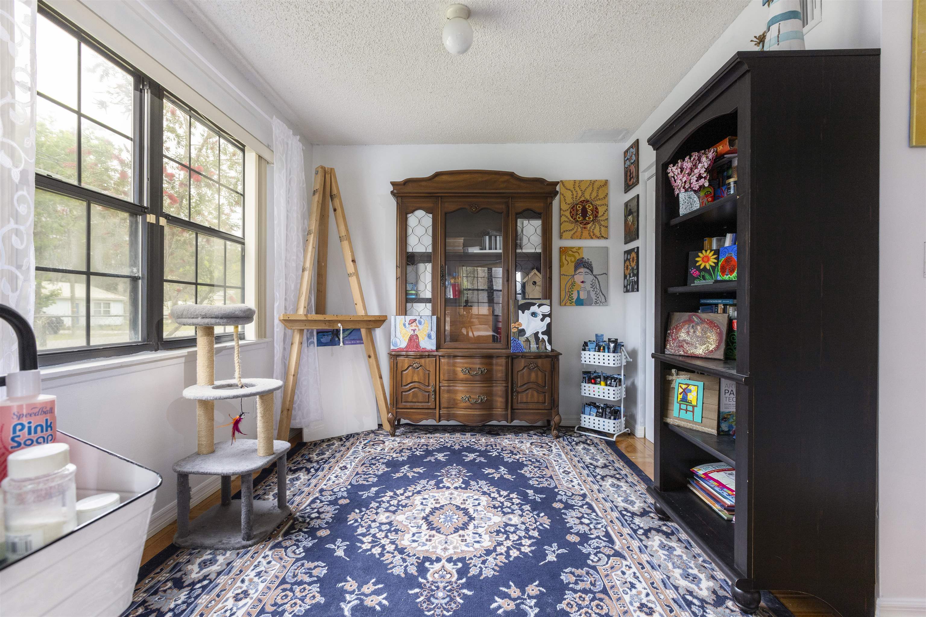 4240 New Hampshire Road Elkton, FL 32033 - Photo 18 of 35 a room with furniture and a book shelf