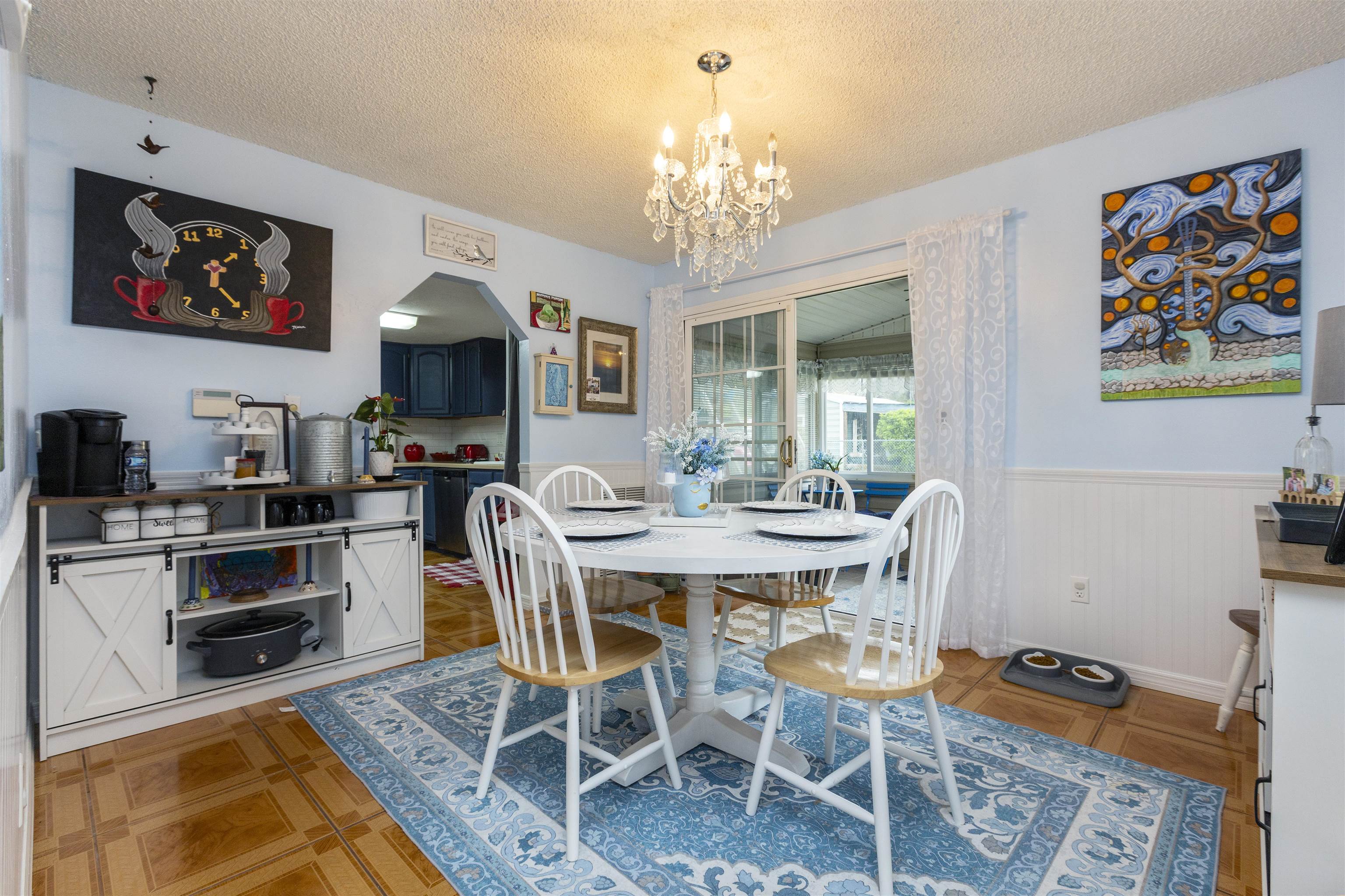 4240 New Hampshire Road Elkton, FL 32033 - Photo 20 of 35 a view of a dining room with furniture a chandelier and wooden floor