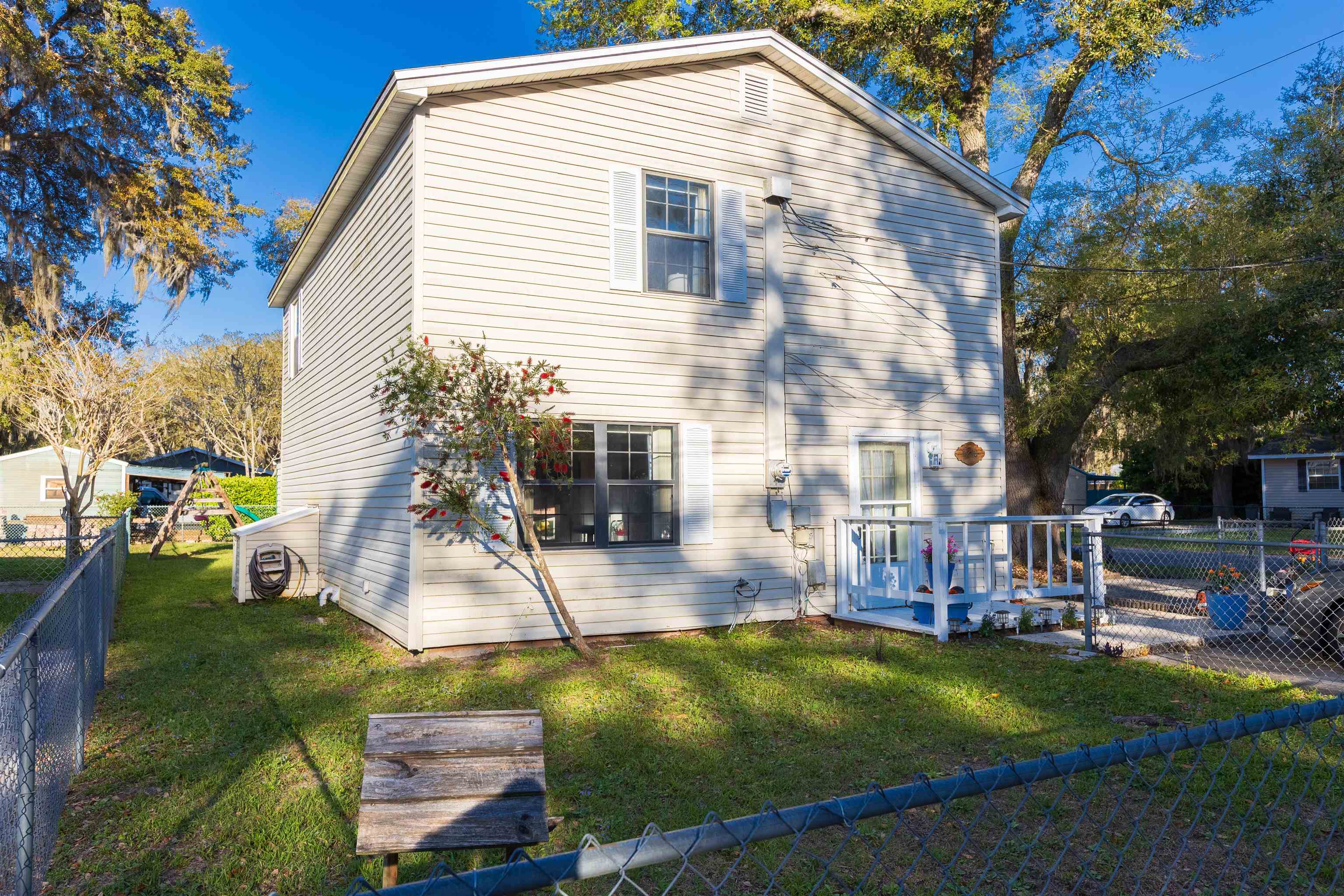 4240 New Hampshire Road Elkton, FL 32033 - Photo 2 of 35 a view of a house with backyard and sitting area