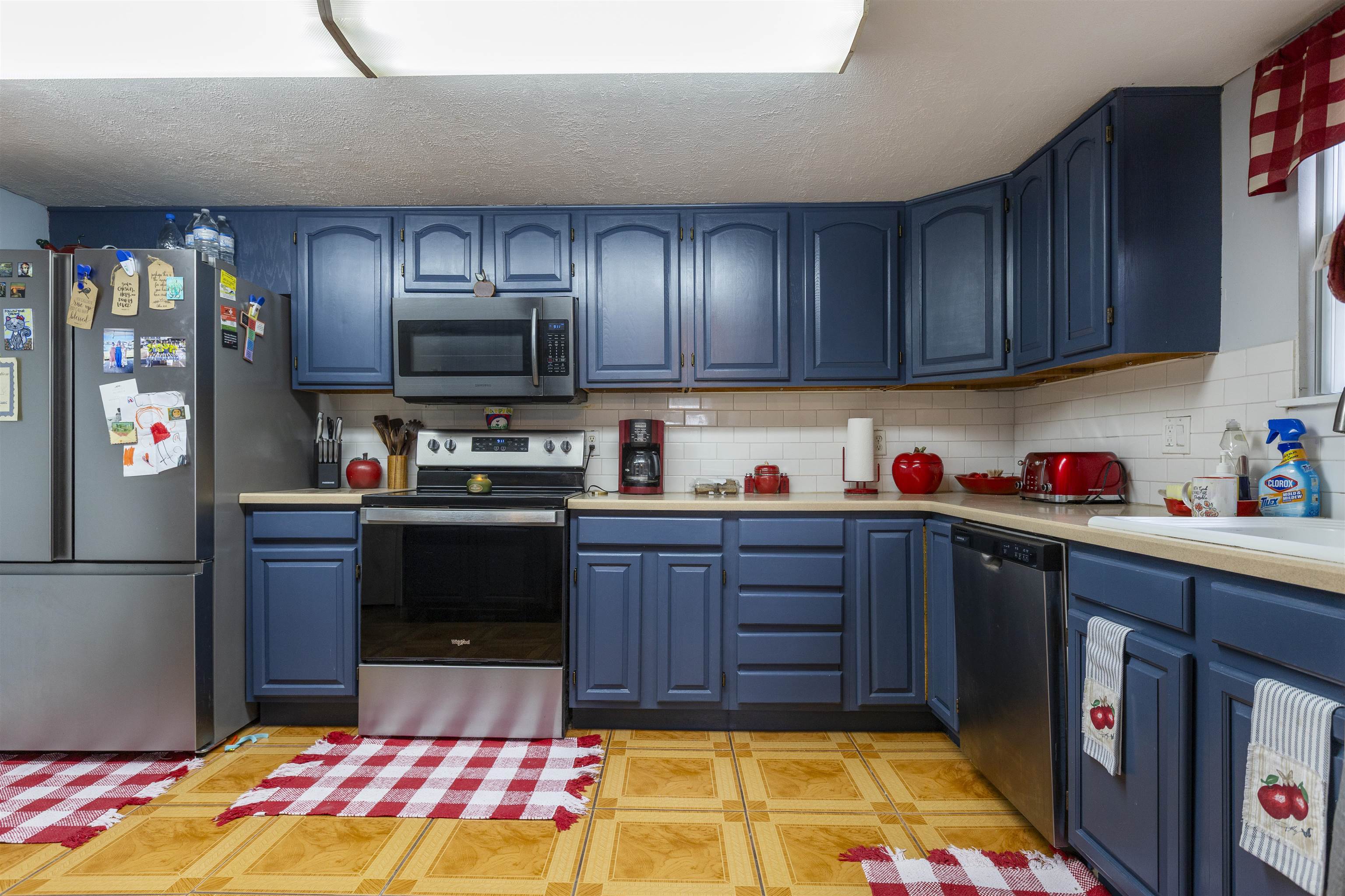 4240 New Hampshire Road Elkton, FL 32033 - Photo 23 of 35 a kitchen with granite countertop wooden cabinets and a stove