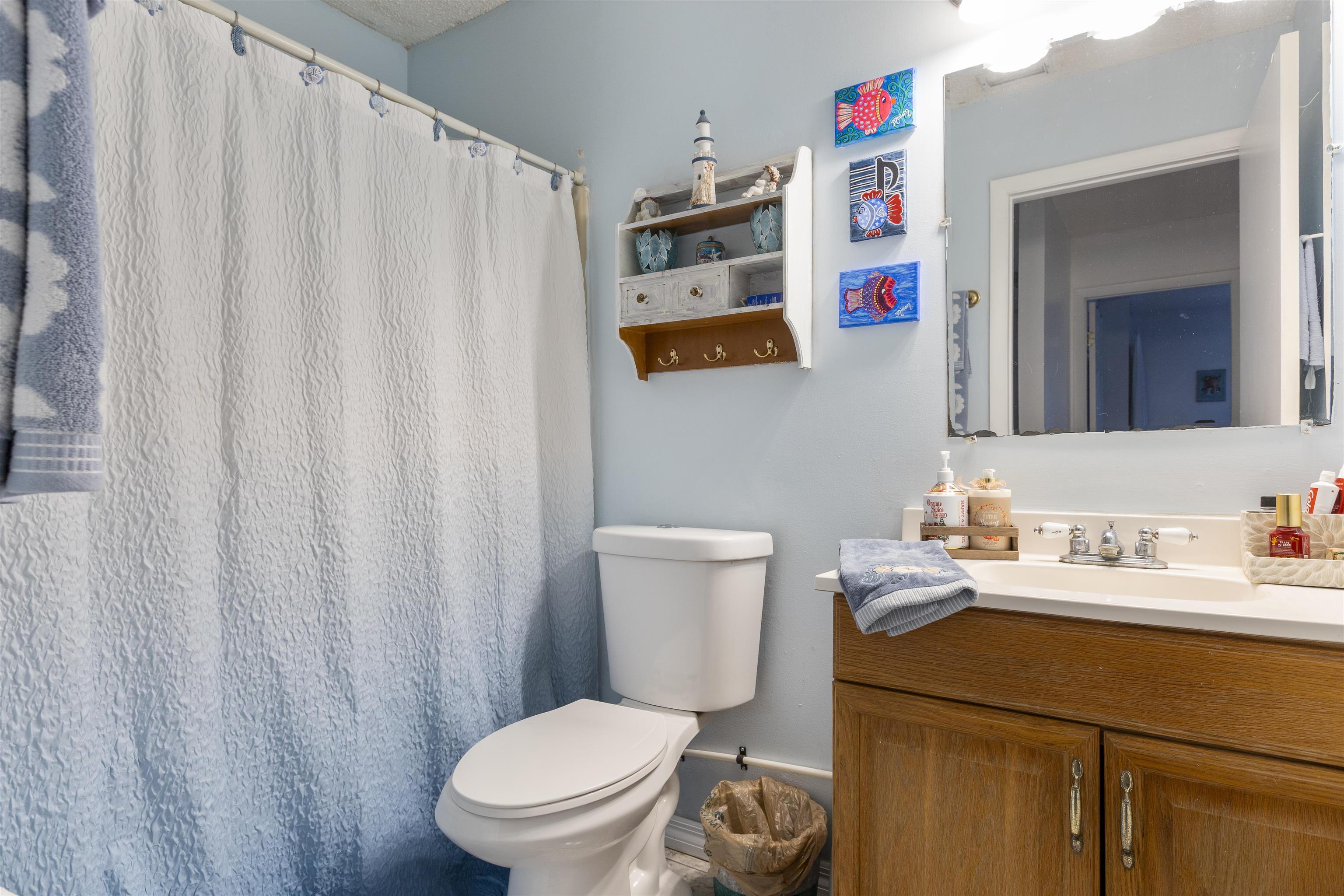 4240 New Hampshire Road Elkton, FL 32033 - Photo 34 of 35 a bathroom with a sink and a toilet