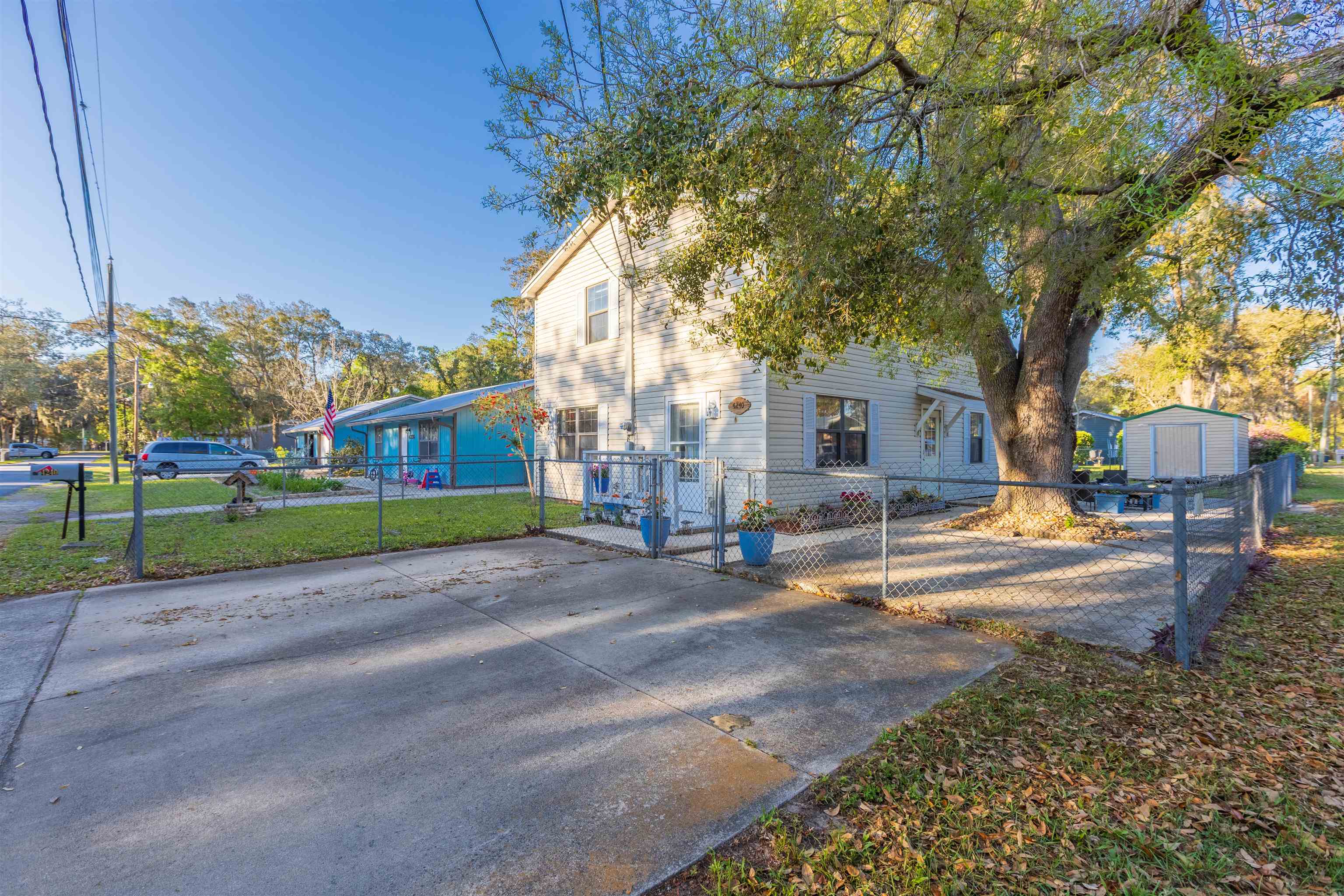 4240 New Hampshire Road Elkton, FL 32033 - Photo 6 of 35 a view of a house with a big yard and large trees