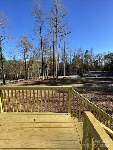 a view of a swimming pool with a house in the background