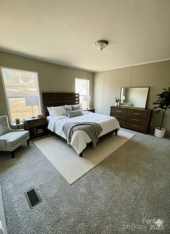 a bedroom with a bed and window