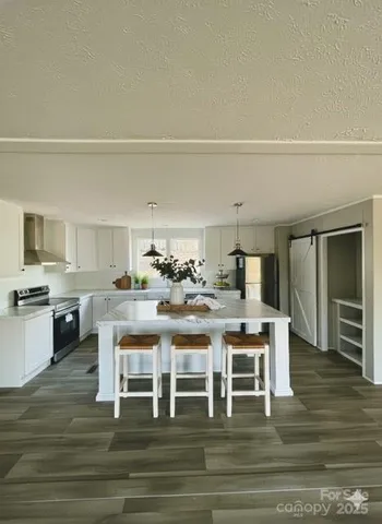 a kitchen with a table and chairs in it