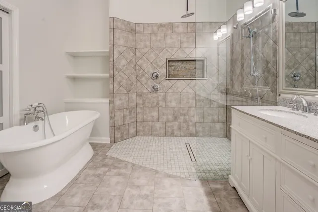 a bathroom with a bathtub and shower