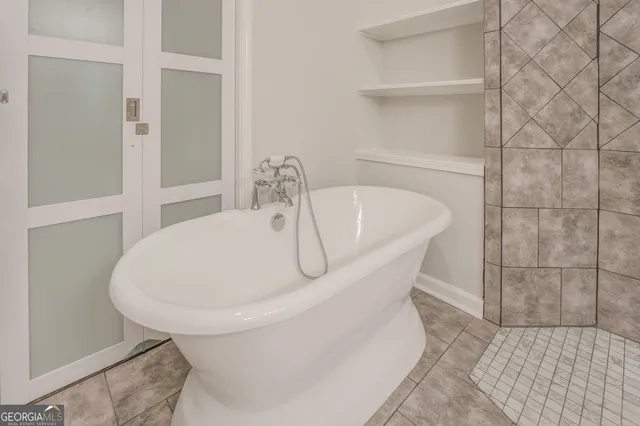 a white bath tub sitting in a bathroom