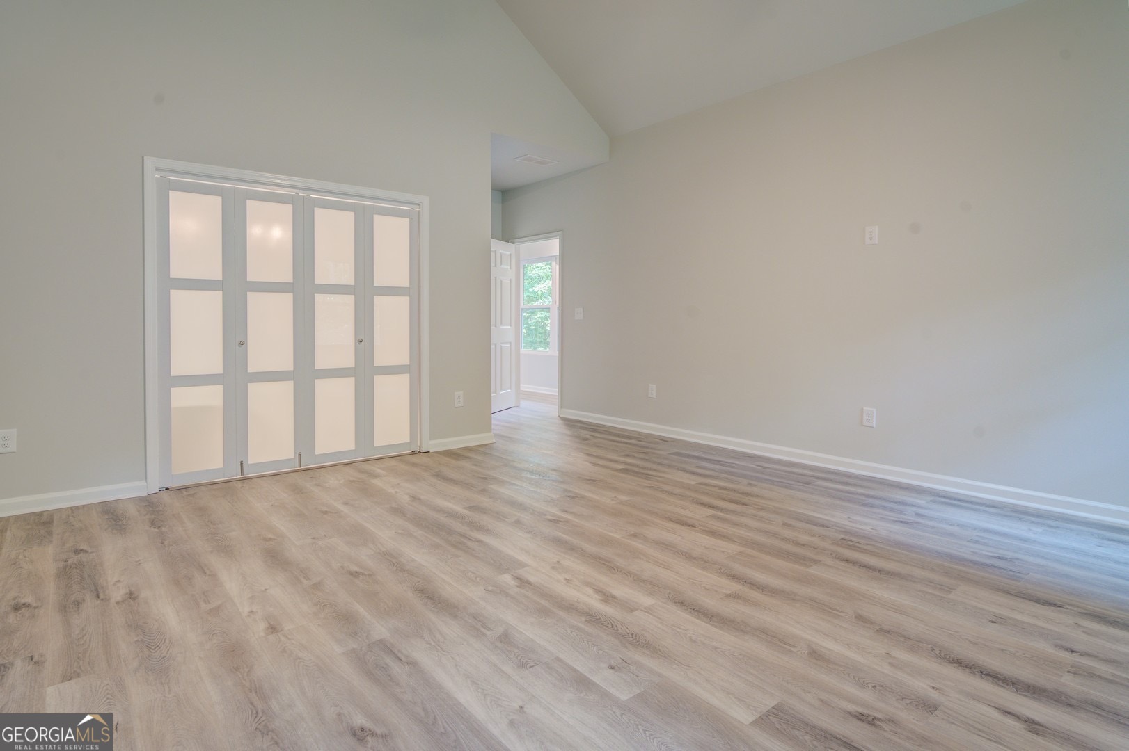 359 Whippoorwill Road Monticello, GA 31064 - Photo 30 of 37 wooden floor in an empty room with a window