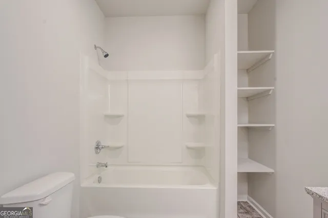 a close up of a bathtub in a bathroom