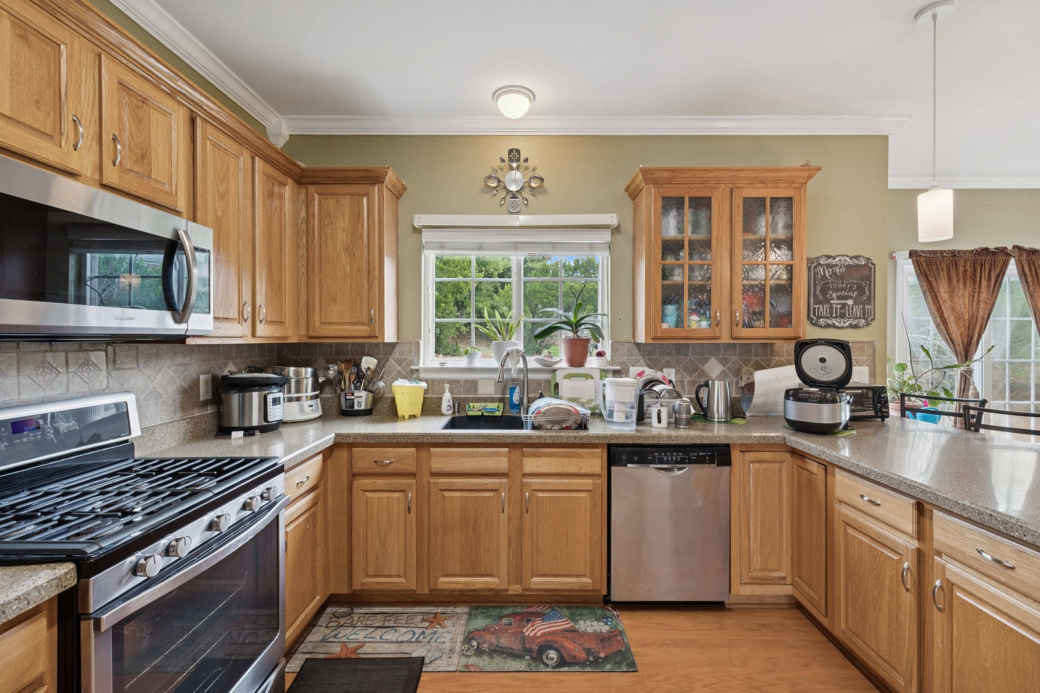 1728 Liberty Pike Franklin, TN 37067 - Photo 17 of 52 a kitchen with stainless steel appliances a sink stove and window
