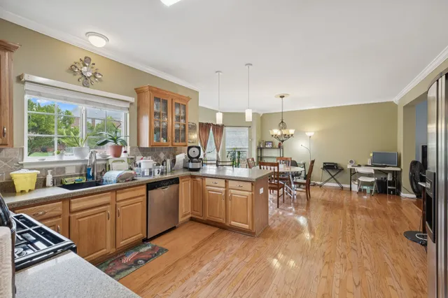 a kitchen with lots of counter top space and dining table
