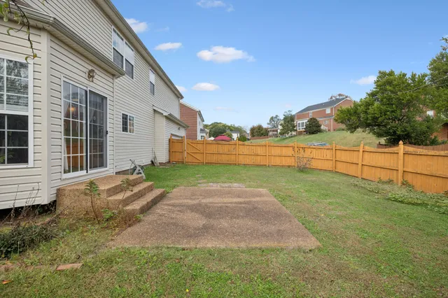 a view of backyard with trampoline