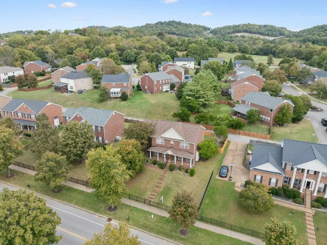 an aerial view of residential house with outdoor space and mountain view