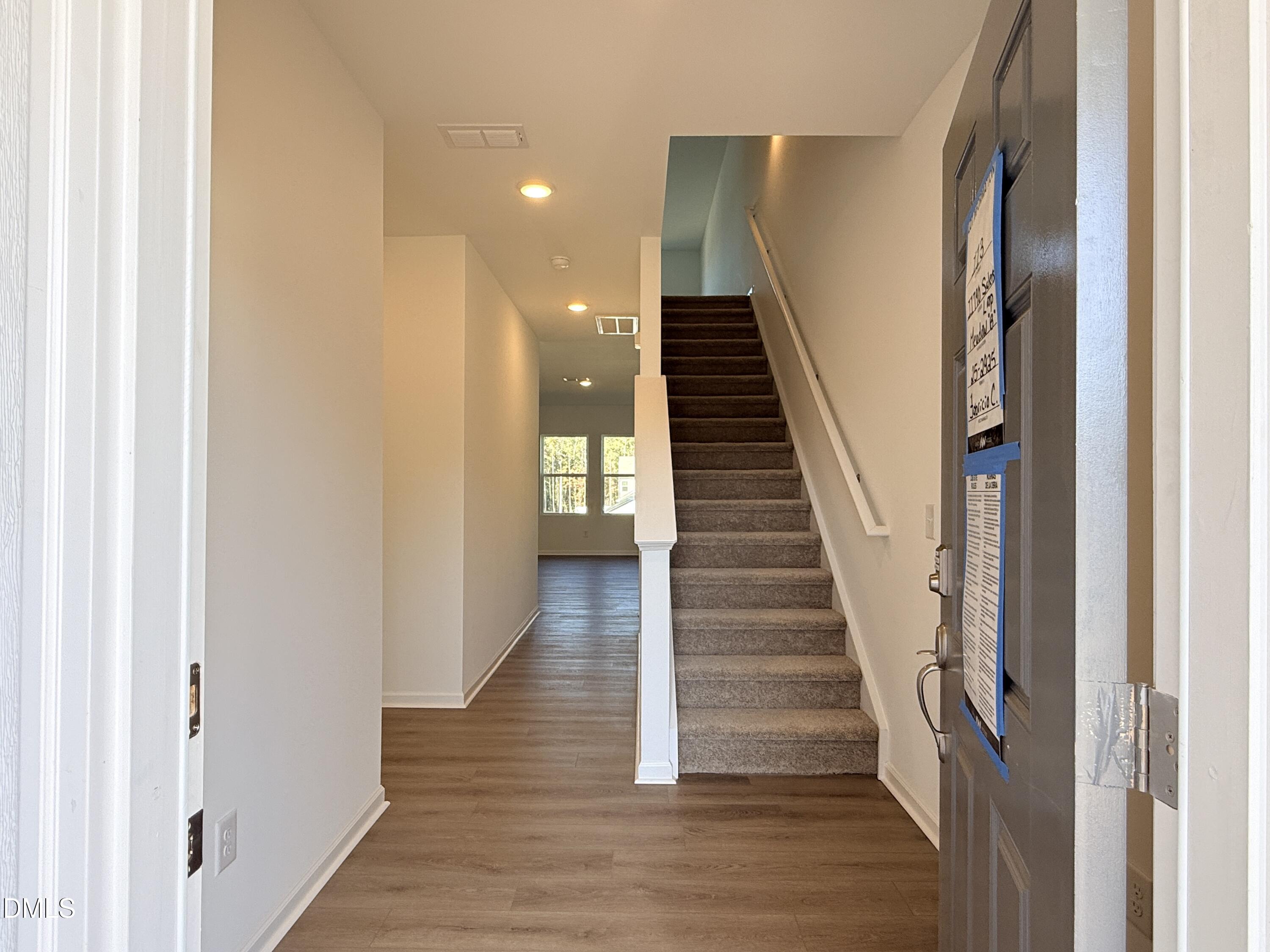 11790 Salers Loop Middlesex, NC 27557 - Photo 25 of 43 a view of a hallway with wooden floor and entryway