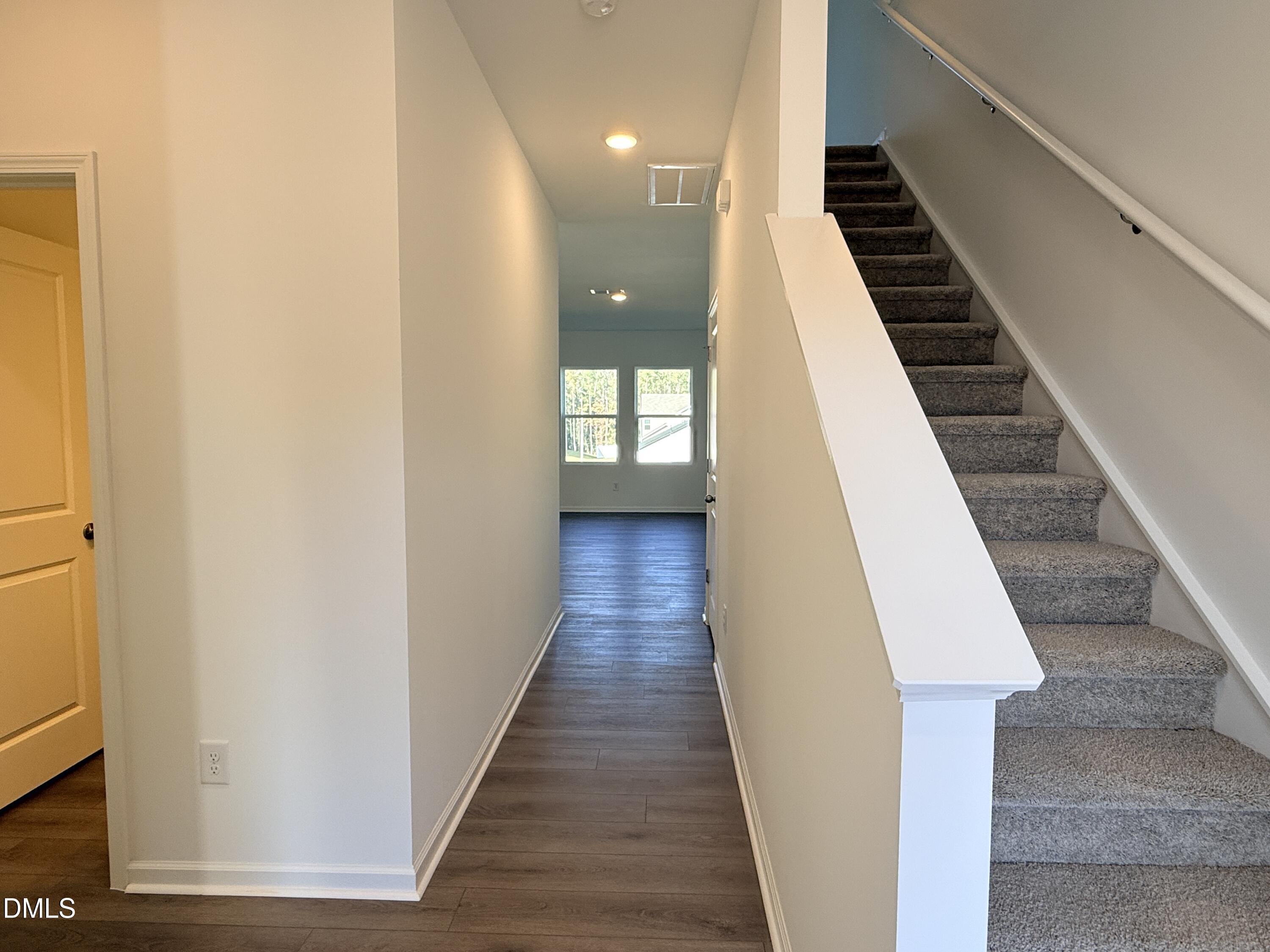 11790 Salers Loop Middlesex, NC 27557 - Photo 26 of 43 a view of a hallway with wooden floor and staircase