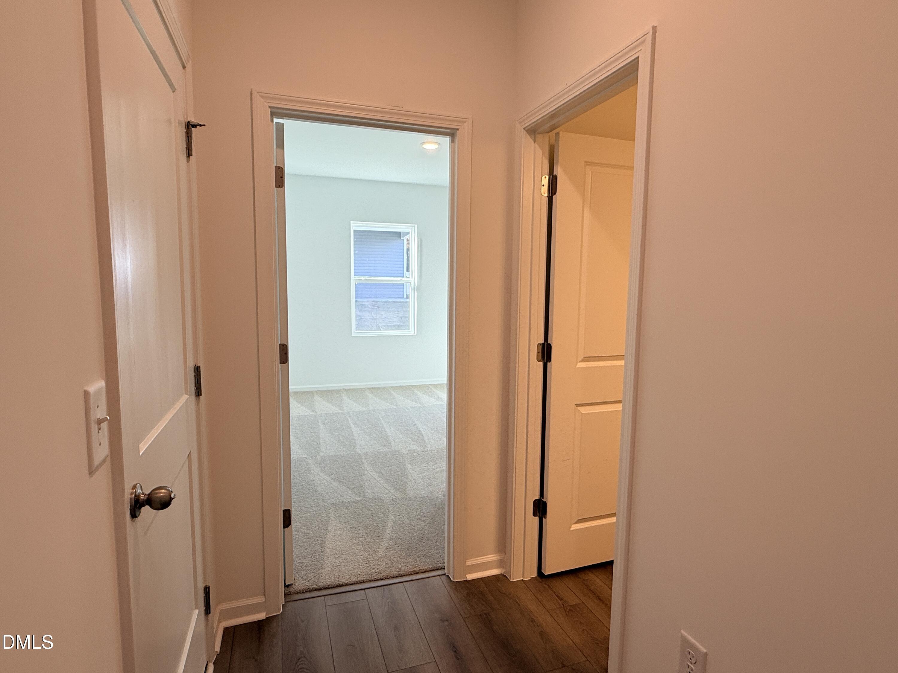 11790 Salers Loop Middlesex, NC 27557 - Photo 27 of 43 an empty room with wooden floor and a door