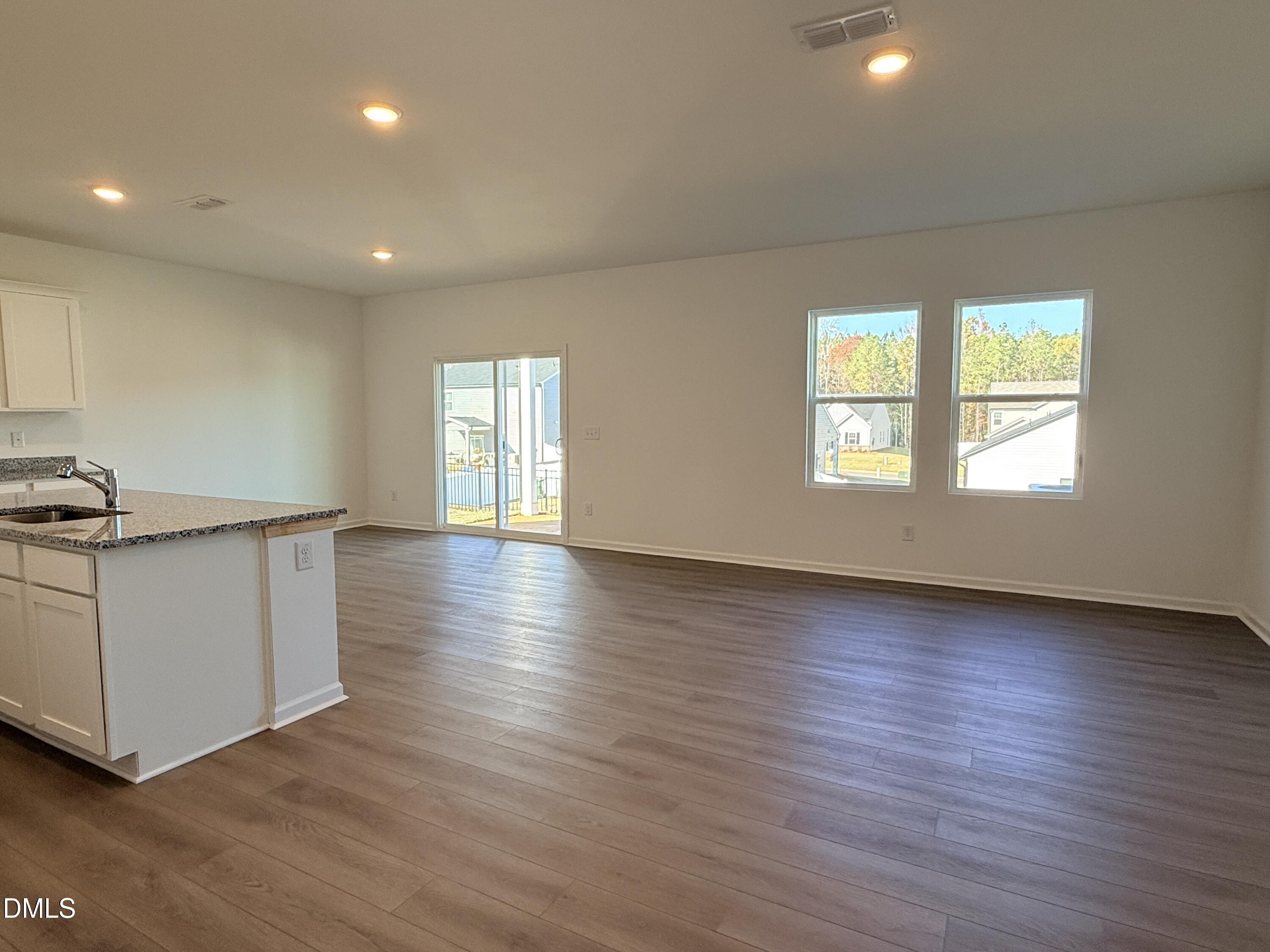 11790 Salers Loop Middlesex, NC 27557 - Photo 32 of 43 a view of an empty room with wooden floor and a window
