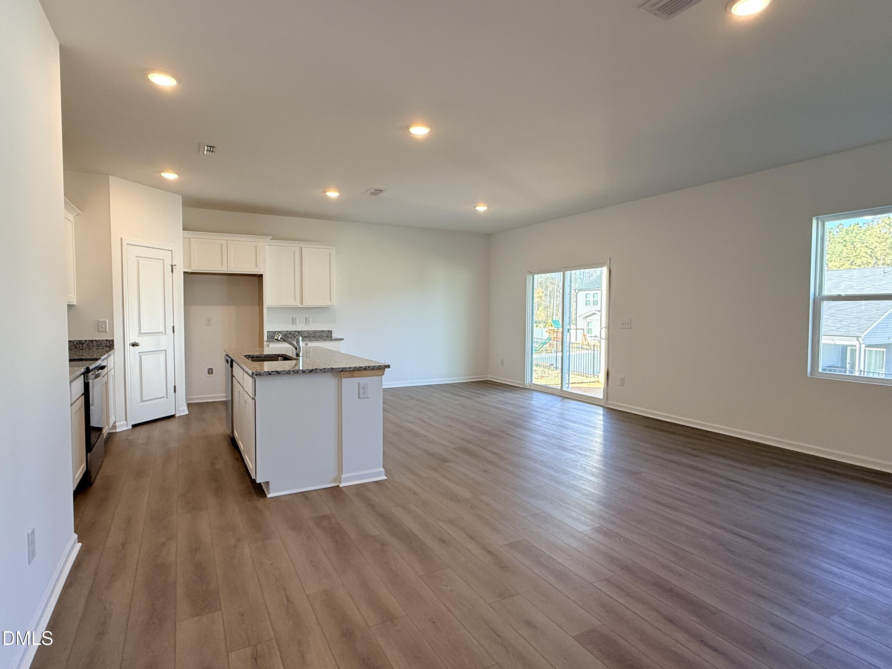 11790 Salers Loop Middlesex, NC 27557 - Photo 33 of 43 a kitchen with hard wood floors and stainless steel appliances