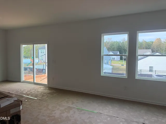 a view of entryway and gallery with wooden floor