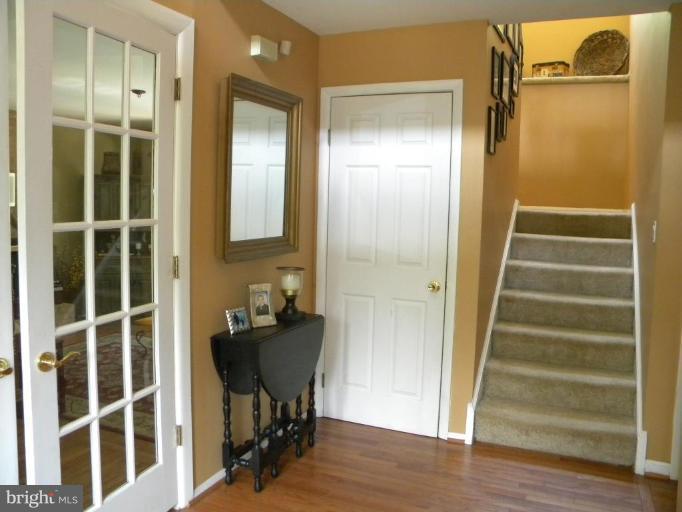 11317 Vale Road Oakton, VA 22124 - Photo 18 of 29 a view of a hallway with wooden floor and windows
