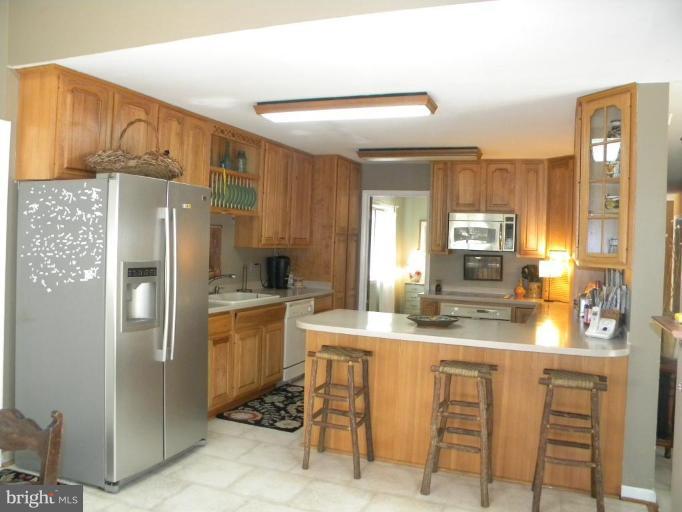 11317 Vale Road Oakton, VA 22124 - Photo 19 of 29 a kitchen with a refrigerator a sink and dishwasher