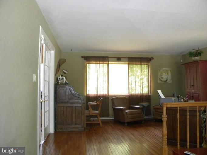 11317 Vale Road Oakton, VA 22124 - Photo 20 of 29 a living room with furniture and a large window