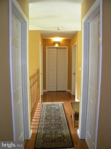 11317 Vale Road Oakton, VA 22124 - Photo 23 of 29 a view of hallway with wooden floor