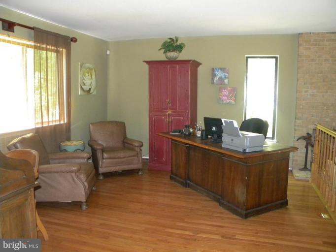 11317 Vale Road Oakton, VA 22124 - Photo 26 of 29 a living room with furniture and a window