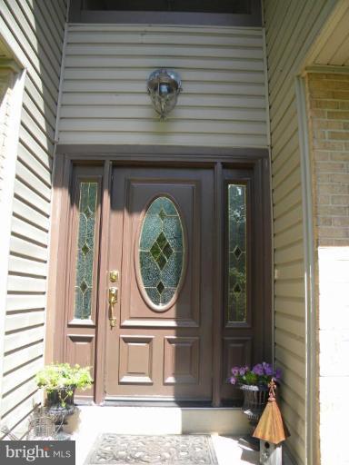 11317 Vale Road Oakton, VA 22124 - Photo 28 of 29 a front view of a house with a porch