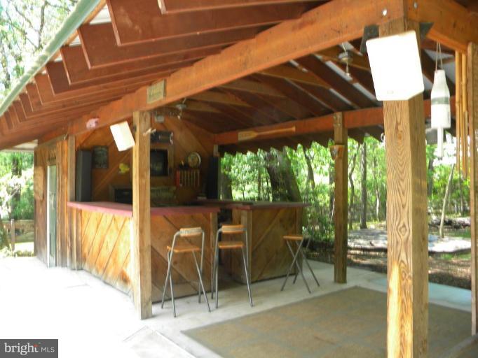 11317 Vale Road Oakton, VA 22124 - Photo 7 of 29 a view of a patio with table and chairs next to a yard