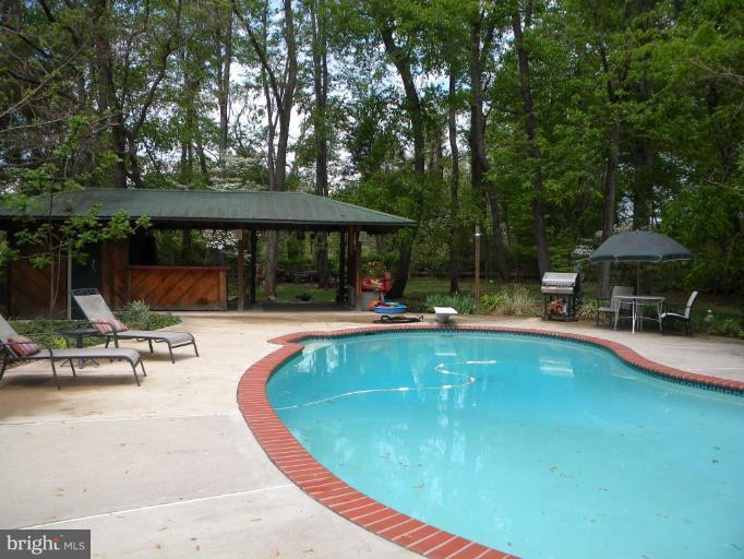 11317 Vale Road Oakton, VA 22124 - Photo 8 of 29 a view of swimming pool with sitting area and furniture