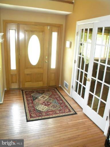 11317 Vale Road Oakton, VA 22124 - Photo 10 of 29 a view of a entryway door with wooden floor