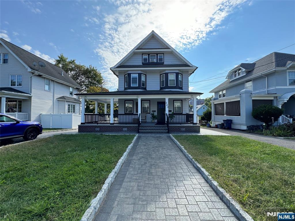 243 Hamilton Place, Unit 2 Hackensack, NJ 07601 - Photo 1 of 9 a front view of house with yard and green space