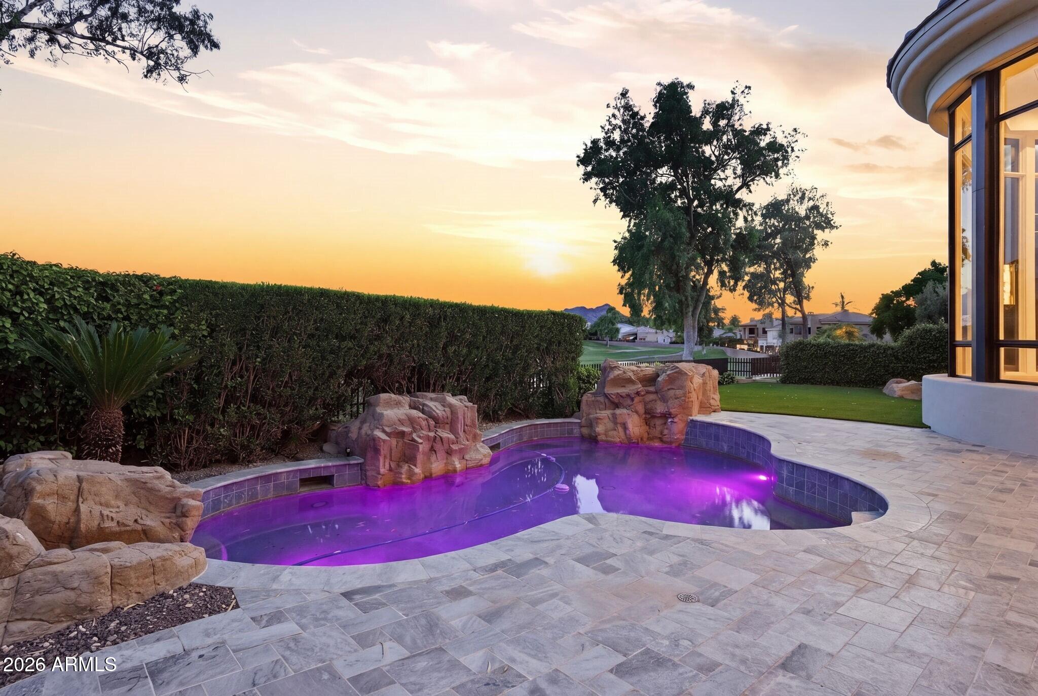 7475 East Gainey Ranch Road, Unit 7 Scottsdale, AZ 85258 - Photo 69 of 77 a view of a yard with furniture and a fire pit