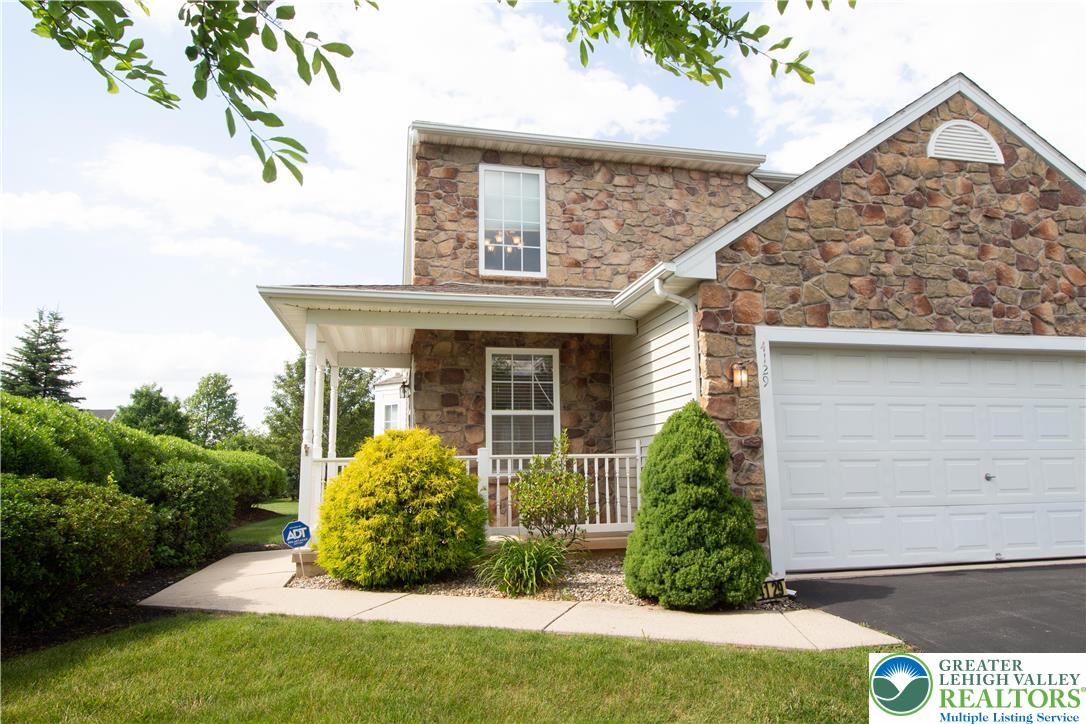 4129 Coleman Street Bethlehem, PA 18020 - Photo 1 of 36 a view of a house with brick walls and a yard with potted plants