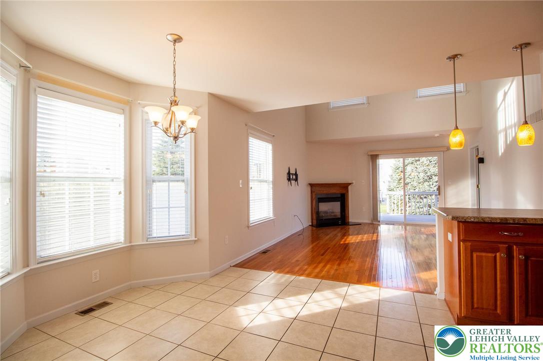 4129 Coleman Street Bethlehem, PA 18020 - Photo 11 of 36 a view of an empty room with window and chandelier