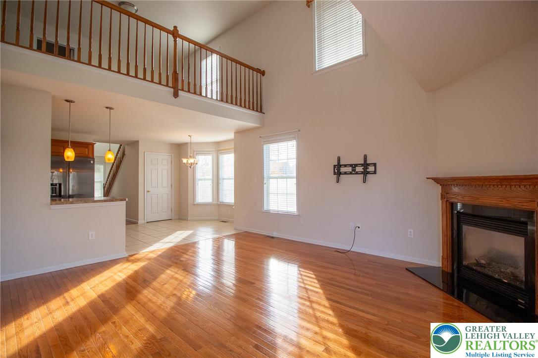 4129 Coleman Street Bethlehem, PA 18020 - Photo 14 of 36 a view of an empty room with wooden floor and a window