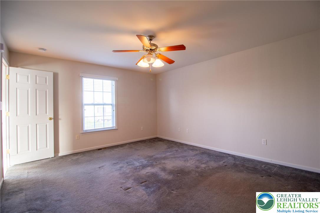 4129 Coleman Street Bethlehem, PA 18020 - Photo 17 of 36 an empty room with windows and chandelier fan