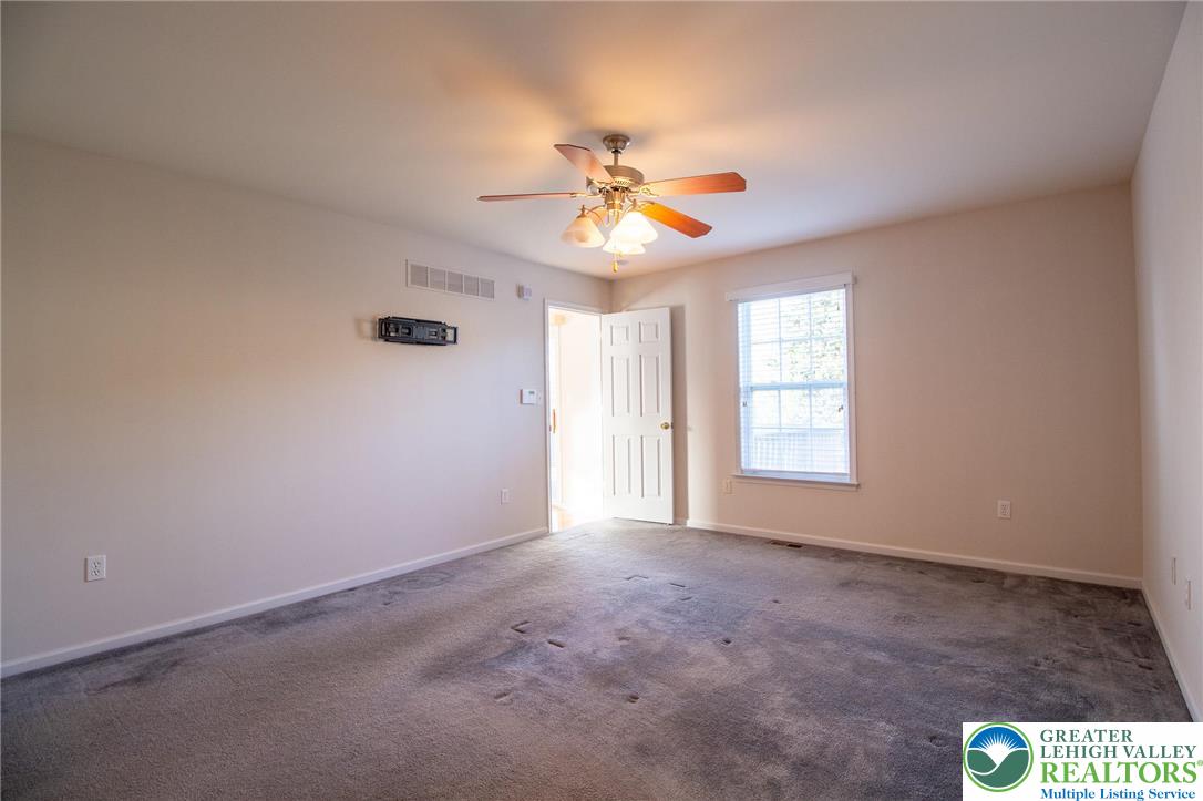 4129 Coleman Street Bethlehem, PA 18020 - Photo 19 of 36 an empty room with windows and fan