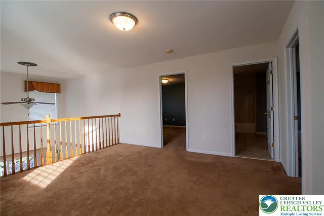 an empty room with staircase