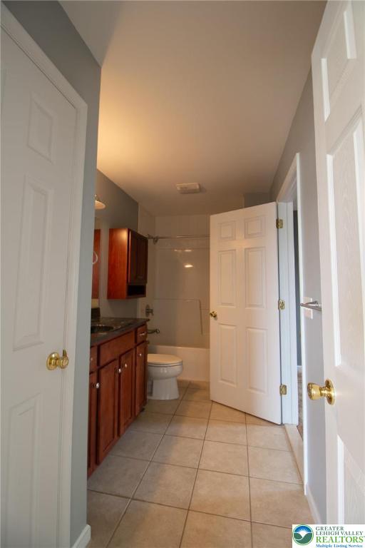 4129 Coleman Street Bethlehem, PA 18020 - Photo 29 of 36 a bathroom with a sink a toilet and mirror