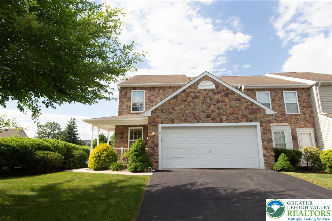 4129 Coleman Street Bethlehem, PA 18020 - Photo 3 of 36 a front view of a house with a yard and garage