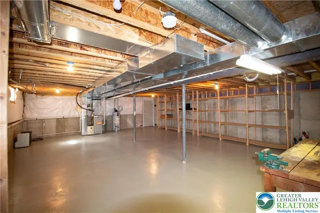 a view of a room with wooden floor and furniture