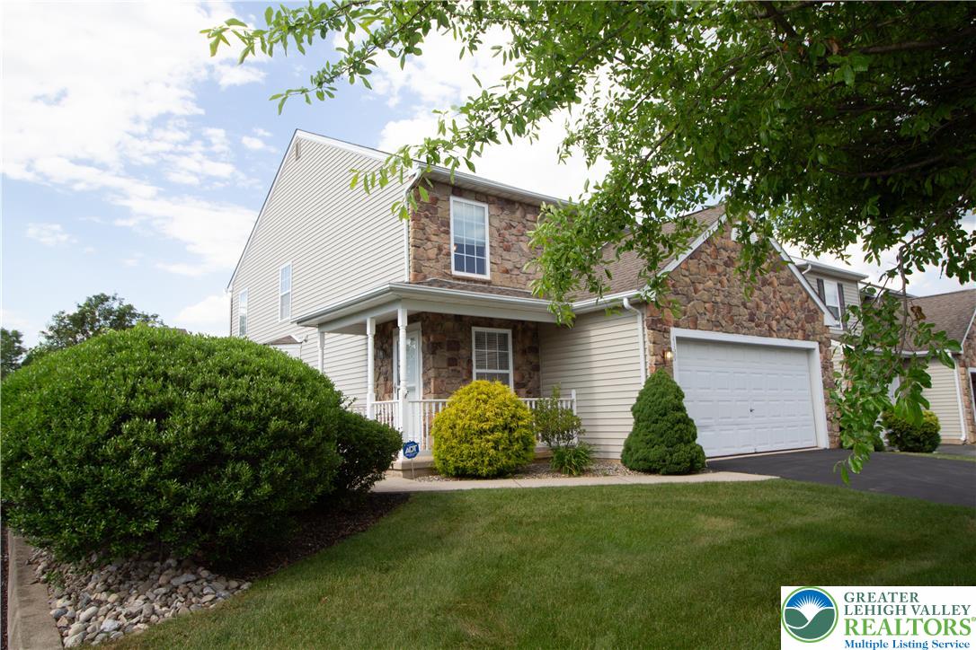 4129 Coleman Street Bethlehem, PA 18020 - Photo 4 of 36 a front view of a house with a garden and plants