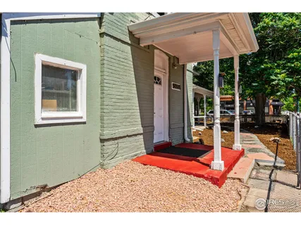 a backyard of a house with seating space