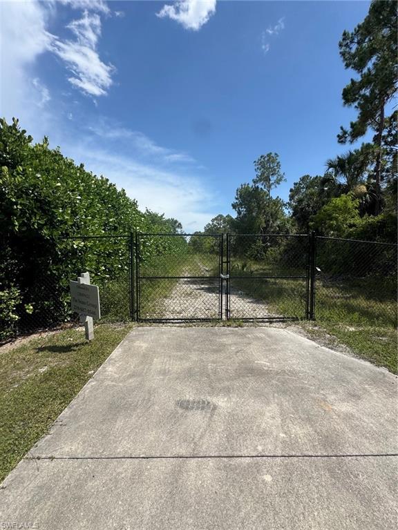 4792 11th Avenue Southwest Naples, FL 34116 - Photo 7 of 8 a view of a yard with a tree