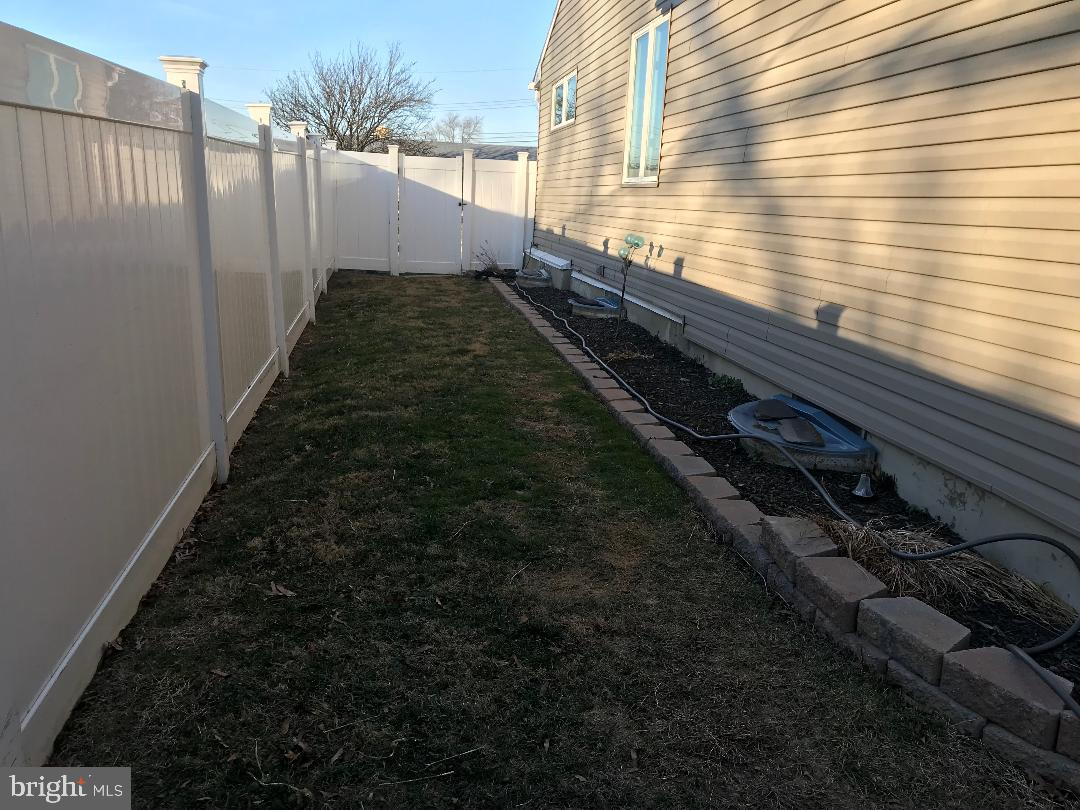 2461 Woodcroft Road Baltimore, MD 21234 - Photo 15 of 33 Side yard fenced with White Vinyl